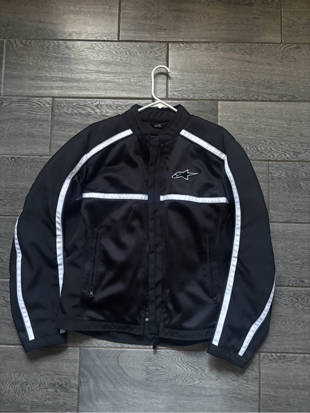 Alpine waterproof Black Jacket with White Trim Performance Mesh. Missing liner